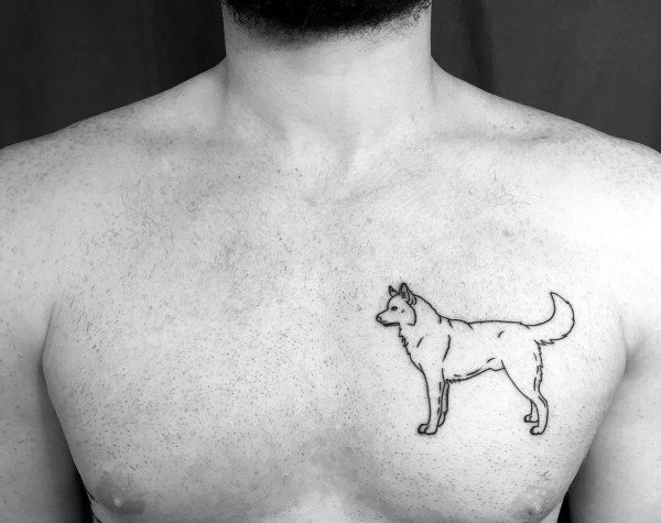 Minimalist Siberian Husky tattoo on a man's chest, featuring a simple black outline design for a clean and understated look.