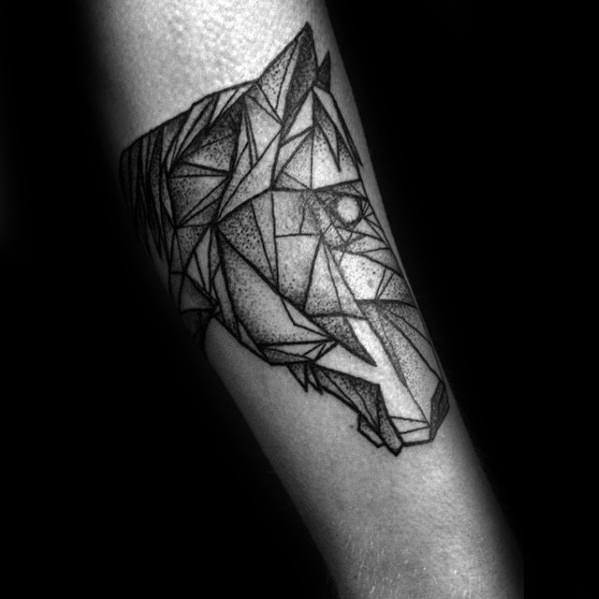 Geometric horse head tattoo on the forearm, created with sharp angular shapes and dotwork shading for a bold abstract style.