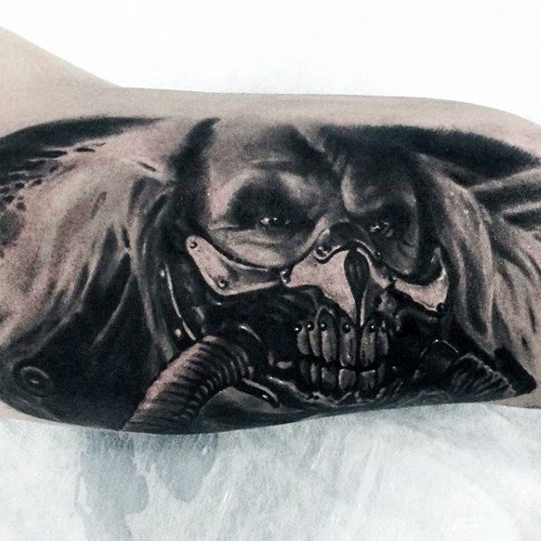 Mens Tattoo Ideas With Mad Max Design On Inner Arm