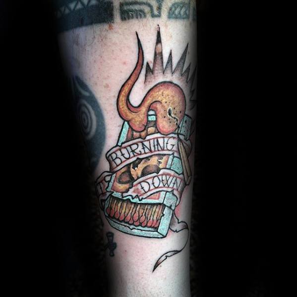 Colorful matchbox tattoo with flames and a “Burning Down” banner, symbolizing chaos, transformation, or starting anew through destruction.