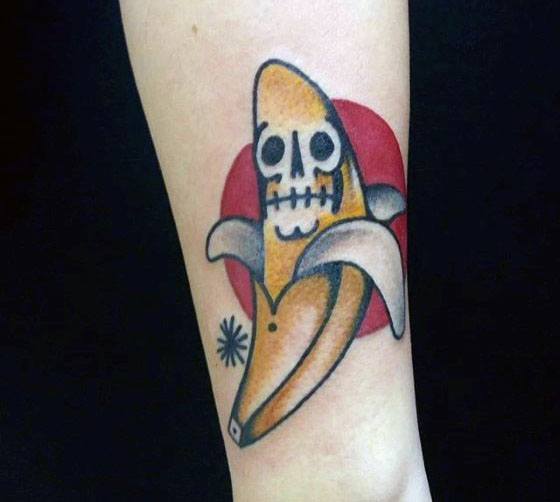 Mens Tattoo Ideas With Skull Banana And Red Sun Design On Forearm