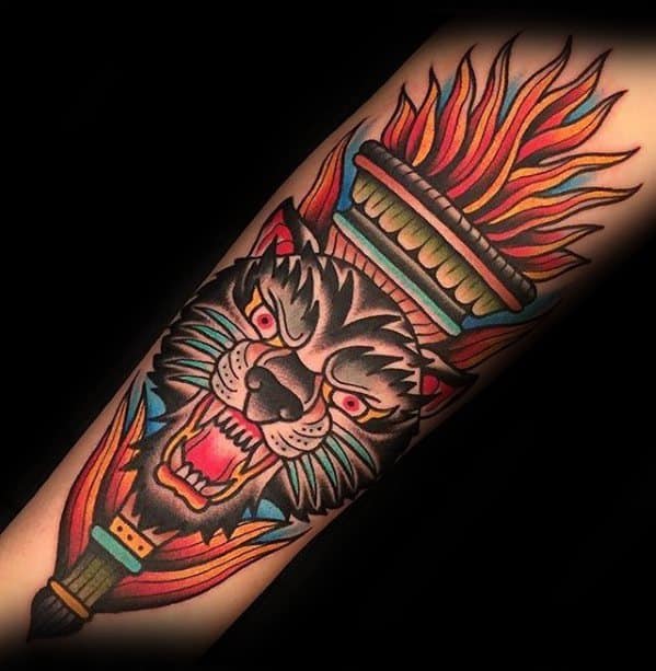 Bold torch tattoo with vibrant flames and a fierce black panther face emerging from the center, surrounded by colorful detailing.