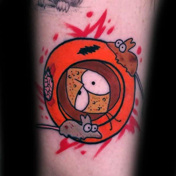 Dark-humor South Park tattoo of Kenny’s lifeless face inside his hood, surrounded by rats, with bold colors and blood splatter effects.
