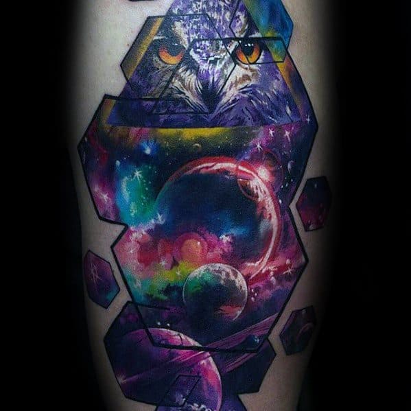 A colorful nebula tattoo, planets,  an owl and cosmic space framed by geometric shapes