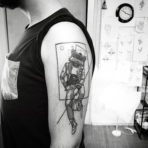 Mens Tattoo Of Figure With Typewriter Head On Arm