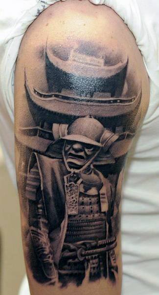 Realistic black and grey upper arm tattoo of a Japanese samurai in traditional armor with intense shading and a fierce expression.
