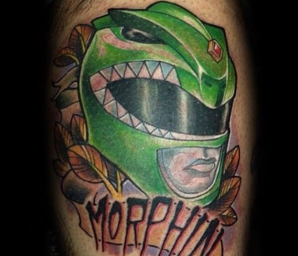 Traditional-style Green Ranger helmet tattoo with bold outlines, leaf accents, and the word "MORPHIN" in dripping red letters below.