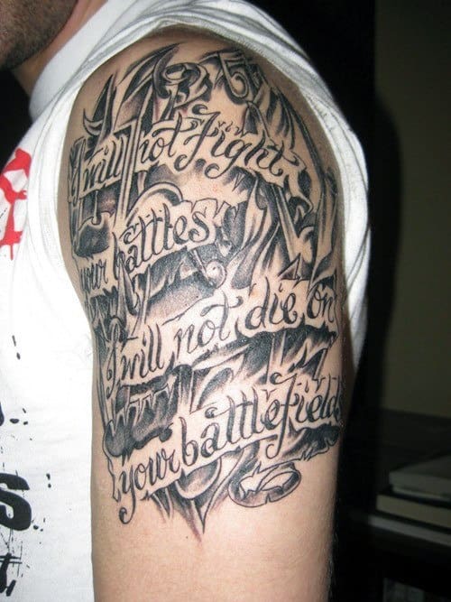 Shoulder tattoo with intricate script text: "I will not fight your battles. I will not die on your battlefield"