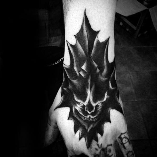 Dark Souls-themed sleeve tattoo with a shadowy armored knight, detailed helmet, and dramatic contrast in black ink.