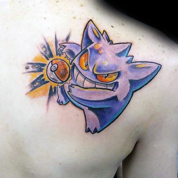 Playful Gengar tattoo on the shoulder with glowing orange eyes, holding a Poké Ball mid-attack, surrounded by bright impact effects.