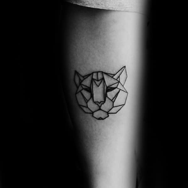 Minimal geometric tiger head tattoo with clean black outlines and sharp angular shapes, placed on the upper leg for a subtle bold look.