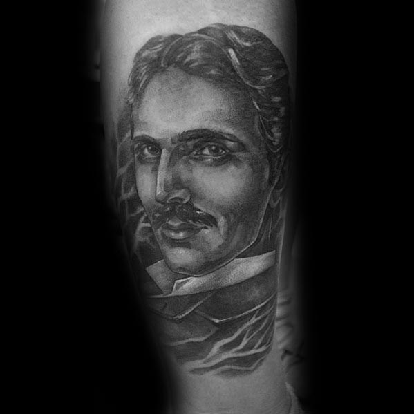 Realistic black and grey tattoo of Nikola Tesla with smooth shading and a background featuring subtle lightning patterns.