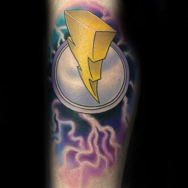 Bright yellow Power Rangers lightning bolt tattoo over a circular medallion, with a vivid purple and blue lightning background.