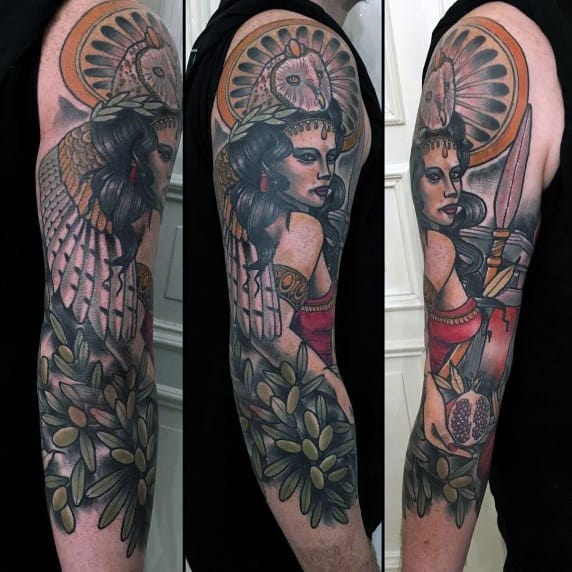 Full-color Athena sleeve tattoo with bold outlines, olive branches, owl halo, and mythological symbols in a neo-traditional art style