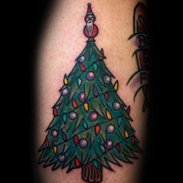 Traditional Christmas tree tattoo with colorful lights, ornaments, and a unique Santa figurine topper, creating a festive and classic holiday design.