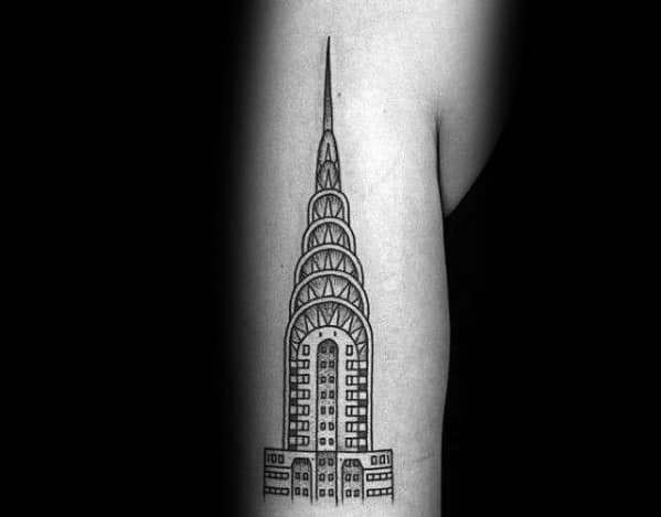 Minimalist Chrysler Building tattoo with clean black outlines and geometric details, creating a sleek and modern architectural design.