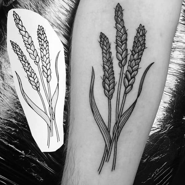 Clean black line tattoo of four detailed wheat stalks with long leaves, shown beside the original stencil design.