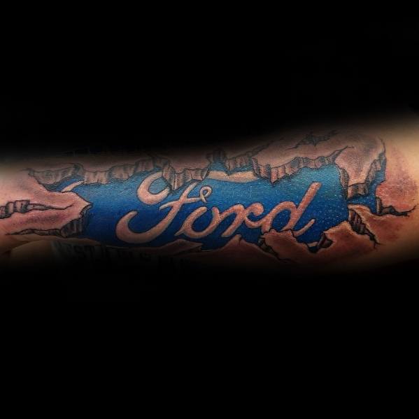 Ford logo tattoo on forearm with a ripped-skin effect, featuring a bold blue emblem and realistic torn flesh detailing for a striking 3D look.