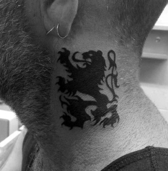 Bold black tribal lion neck tattoo with sharp, intricate lines, creating a powerful and striking design that symbolizes strength and courage.