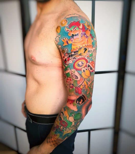 Full-sleeve *Super Mario* tattoo featuring vibrant colors and detailed characters, including Mario, Bowser, Yoshi, and power-ups in an action-packed design.