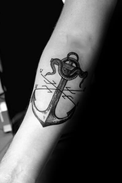 Anchor and compass tattoo with fine-line detailing, featuring a coiled rope for a bold nautical design symbolizing stability and direction.