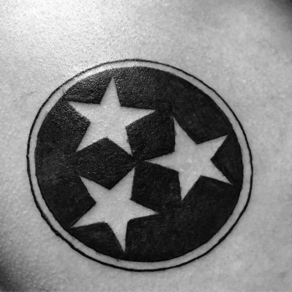 Black and grey Tennessee three-star emblem tattoo with a bold circular design, representing state pride and unity in a classic style.