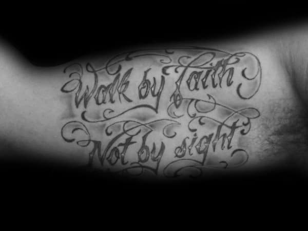Tattoo featuring "Walk by Faith, Not by Sight" in elegant script with decorative flourishes, creating a bold and inspirational design.