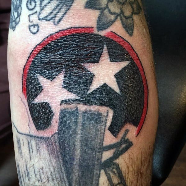 Tennessee three-star emblem tattoo with a torn skin effect, featuring bold black and red shading for a rugged and dynamic look.