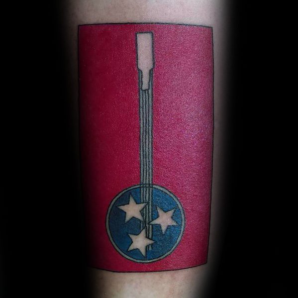 Tennessee flag tattoo featuring a banjo with the three-star emblem, blending state pride with a tribute to its rich musical heritage.