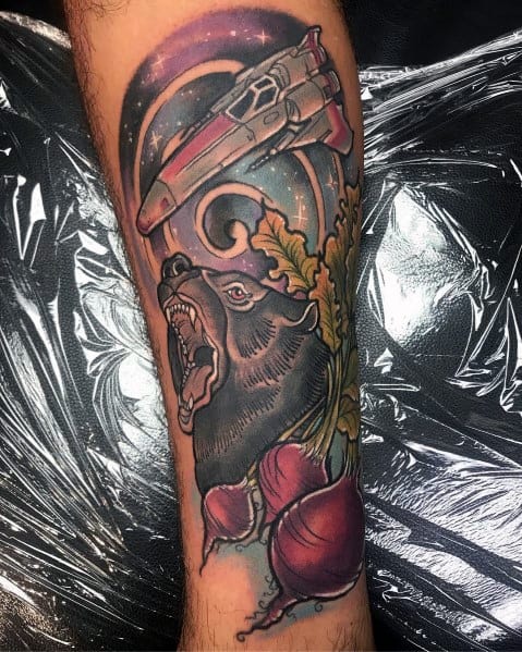 Color tattoo featuring *The Office* references, including a roaring bear, beets, and a *Battlestar Galactica* spaceship, nodding to Dwight Schrute’s famous "Bears, Beets, Battlestar Galactica" quote.