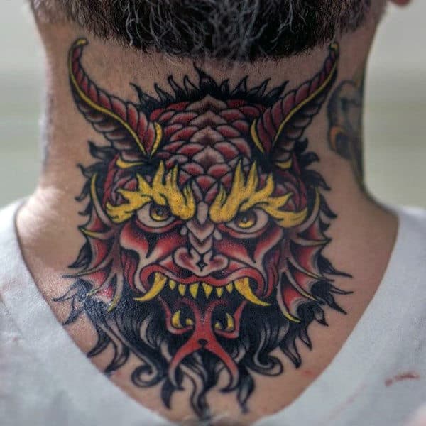 Throat tattoo featuring a fierce red and black demon with sharp yellow details, bold shading, and intense facial expression