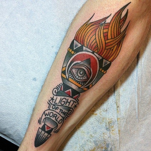 Torch tattoo with stylized orange flames, an all-seeing eye, and a banner reading “LIGHT OF THE WORLD” on the lower leg.