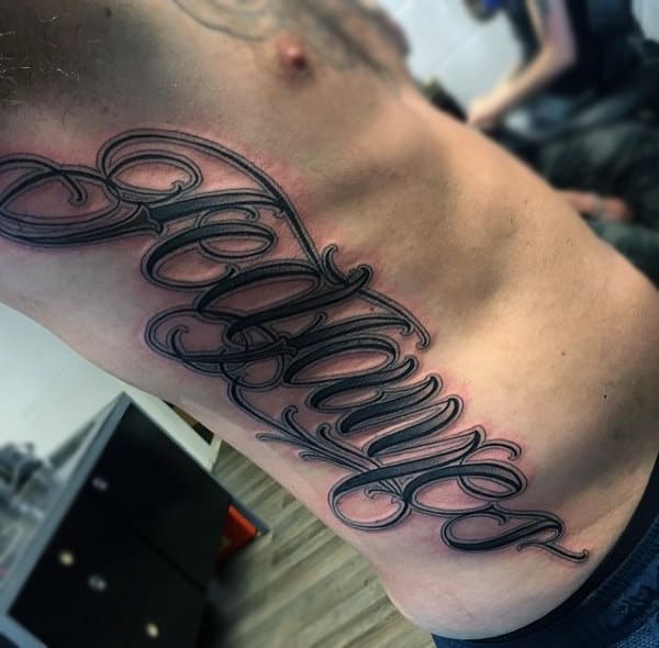Mens Torso Cursive Lettering Tattoo