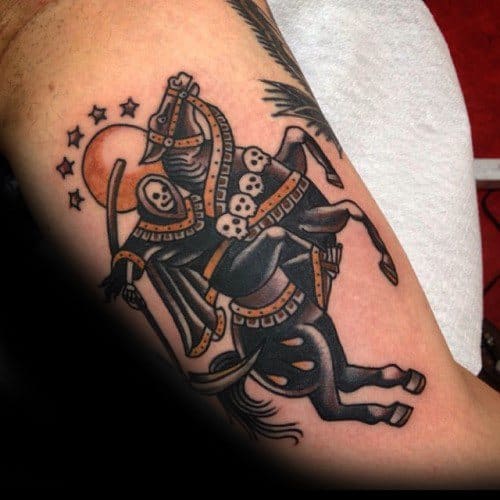 Traditional tattoo of a skeleton warrior riding a rearing horse, with skull armor, a crescent moon, and stars in the background.