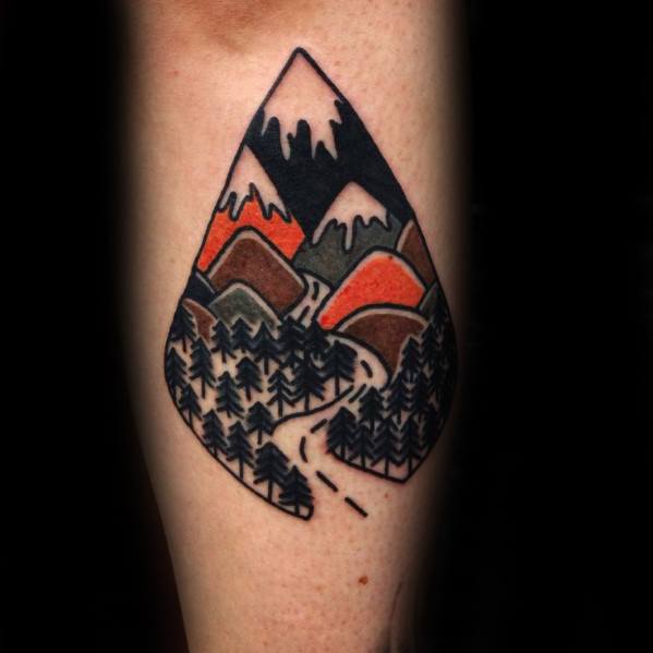 Bold mountain tattoo in a teardrop shape, featuring snowy peaks, red hills, pine forests, and a winding path through the woods.