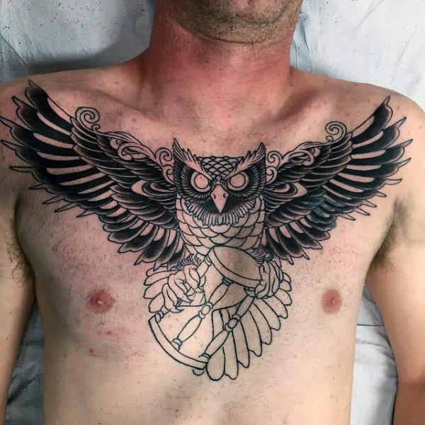 Mens Traditional Tattoo On Chest With Owl Flying With Hourglass
