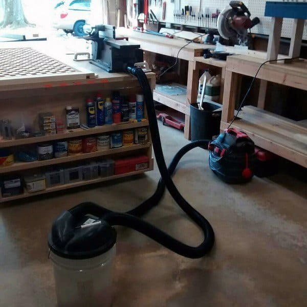 modern garage workshop concrete floor wood benches dirt collection