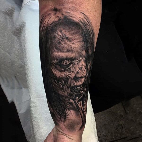 Mens Wrist Tattoo Of Woman With Zombie Virus
