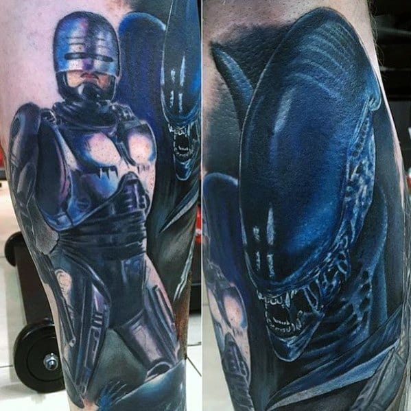 Vivid sci-fi tattoo featuring Robocop and a snarling Xenomorph in blue tones, detailed with metallic and alien textures.