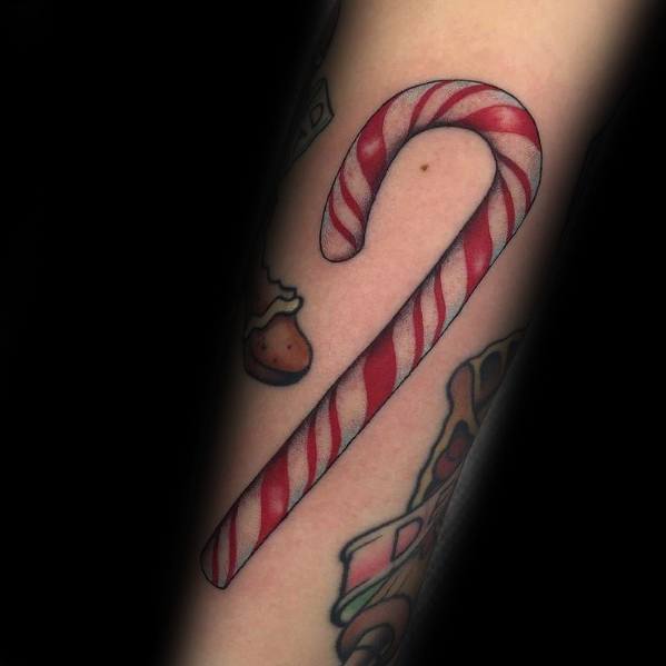 Christmas tattoo of a classic red and white striped candy cane, designed with bold shading and crisp lines for a festive and timeless holiday look.