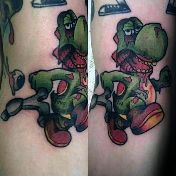 Mens Zombie Themed Yoshi Tattoo On Arm