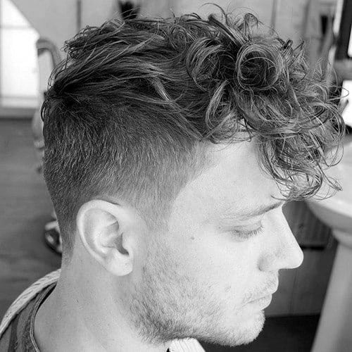 Messy Male Curly Haircut With Side Fade