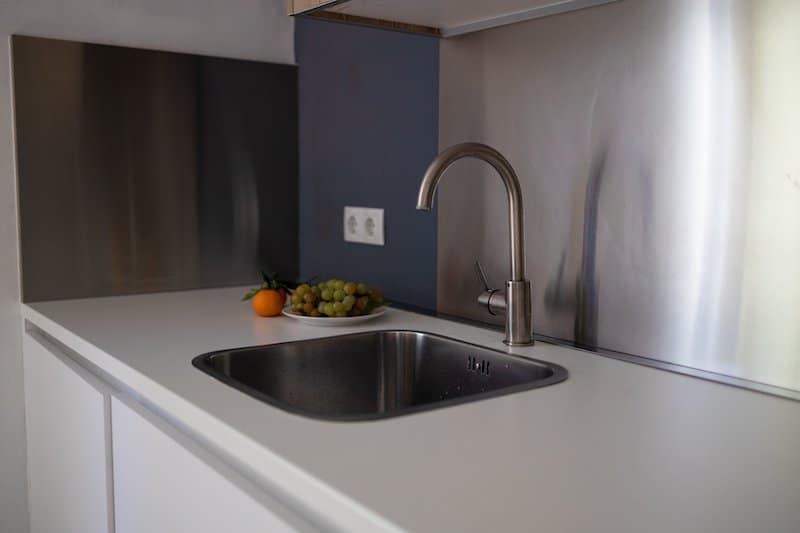 metal backsplash kitchen sink