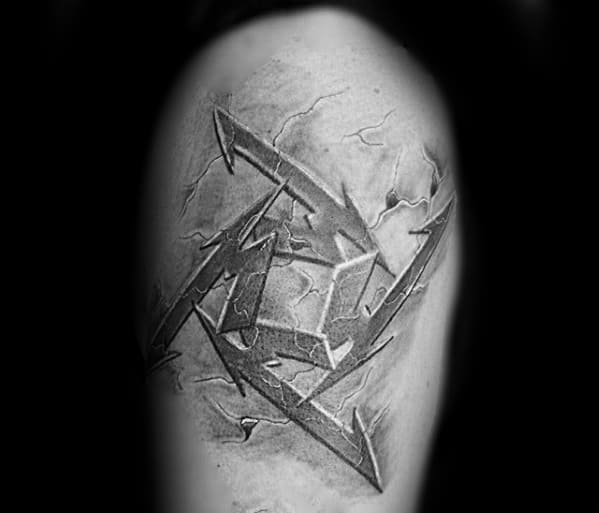 3D-style tattoo of the Metallica ninja star logo on the upper arm, designed with a cracked stone texture for a rugged look.