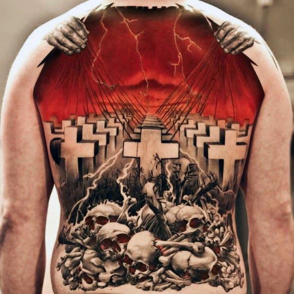 Striking full back tattoo of Metallica’s Master of Puppets scene with white crosses, red sky, puppet strings, and a pile of skulls below.