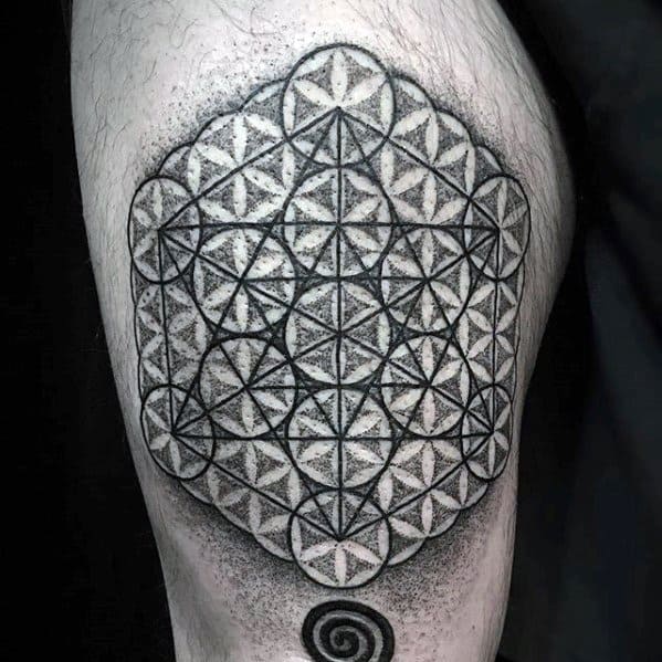 Dotwork thigh tattoo of Metatron’s Cube fused with the Flower of Life pattern, featuring bold outlines and geometric shading for depth.