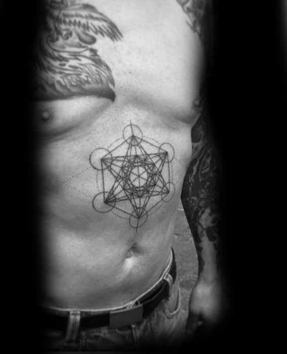 Minimalist Metatron’s Cube tattoo on the left side of the ribcage with fine black lines, subtly placed for a clean sacred geometry look.