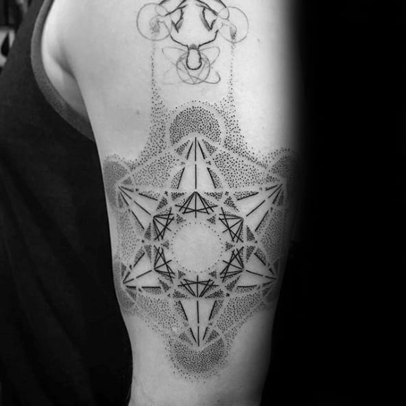 Upper arm Metatron’s Cube tattoo with dotwork shading and abstract geometric accents, forming a textured and visually complex design.