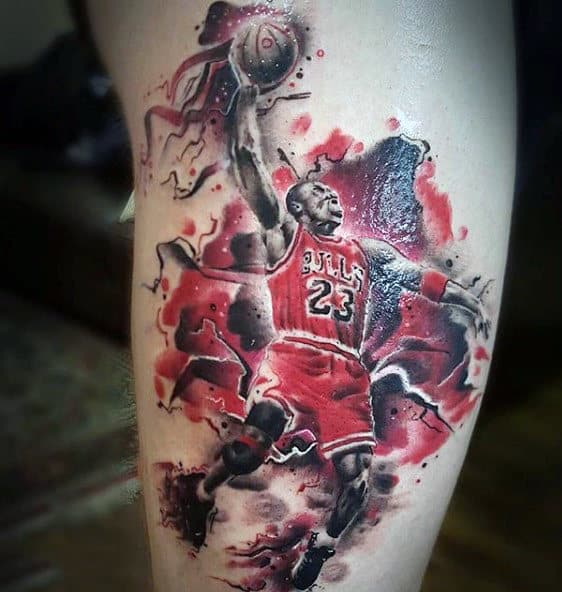 Tattoo of a basketball player in a red uniform, mid-jump with a red and black background