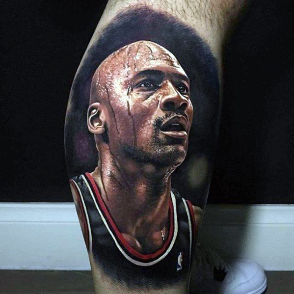 Hyper-realistic color tattoo of a basketball player in game mode, sweat-drenched and focused, wearing a black jersey with red trim.